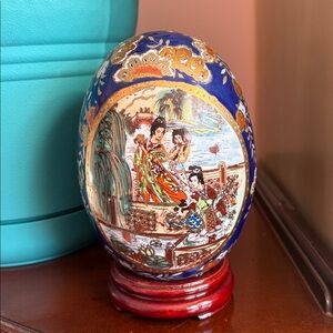 Artistic Blue and Gold Ceramic Egg by [Brand]